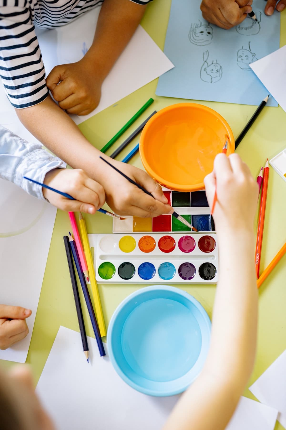 Children painting with watercolors